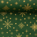 Baumwollstoff Schneeflocken Gold auf Grün 300565